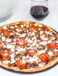 Home-made pizza from scratch with a perfect combination of grilled chicken and feta cheese.