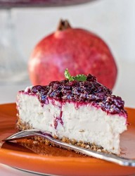 Delicious dessert with loads of berries and pomegranate seeds