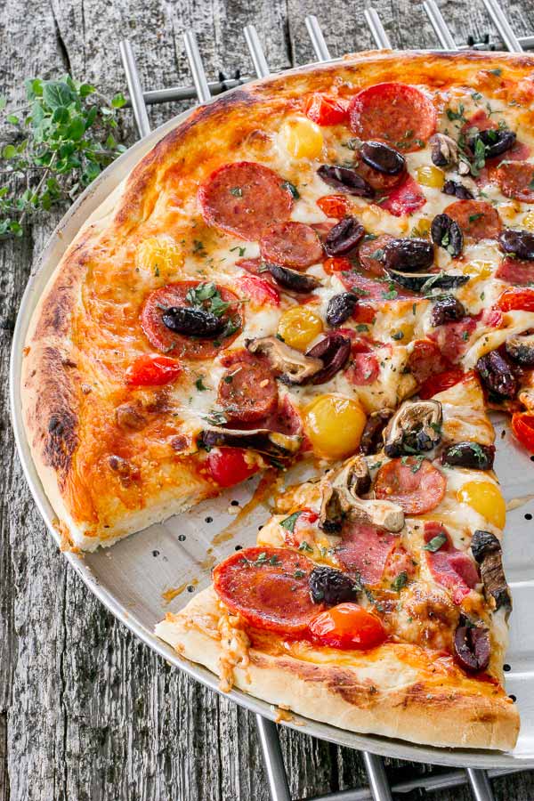 Delicious pizza with a variety of spicy Italian salami and sausage