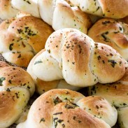 Delicious bread knots with basil and butter