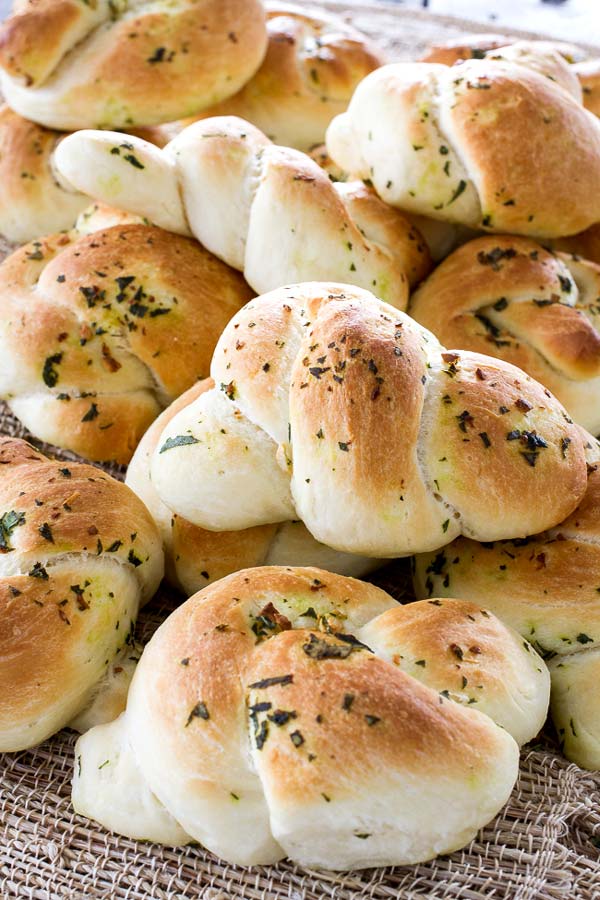 Delicious bread knots with basil and butter