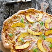 A delicious combination of peaches and Canadian back bacon on a pizza flatbread