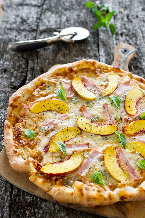 A delicious combination of peaches and Canadian back bacon on a pizza flatbread