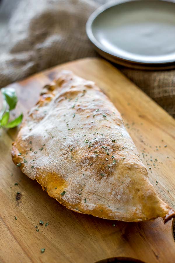 A delicious rustic looking calzone made with loads of ham and cheese, the perfect breakfast.